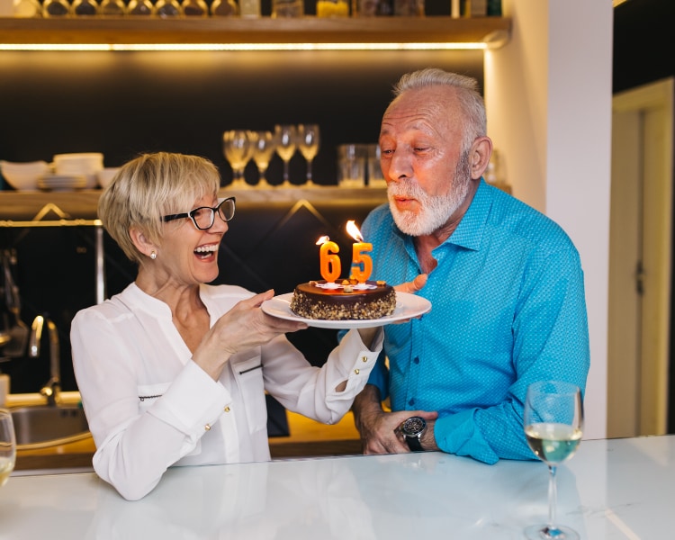 Male blowing out candles